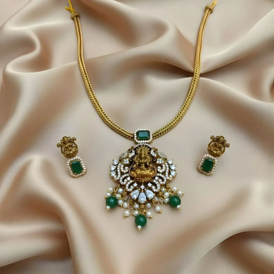 Antique Gold Lakshmi Necklace Set with Green Stones stone detailing