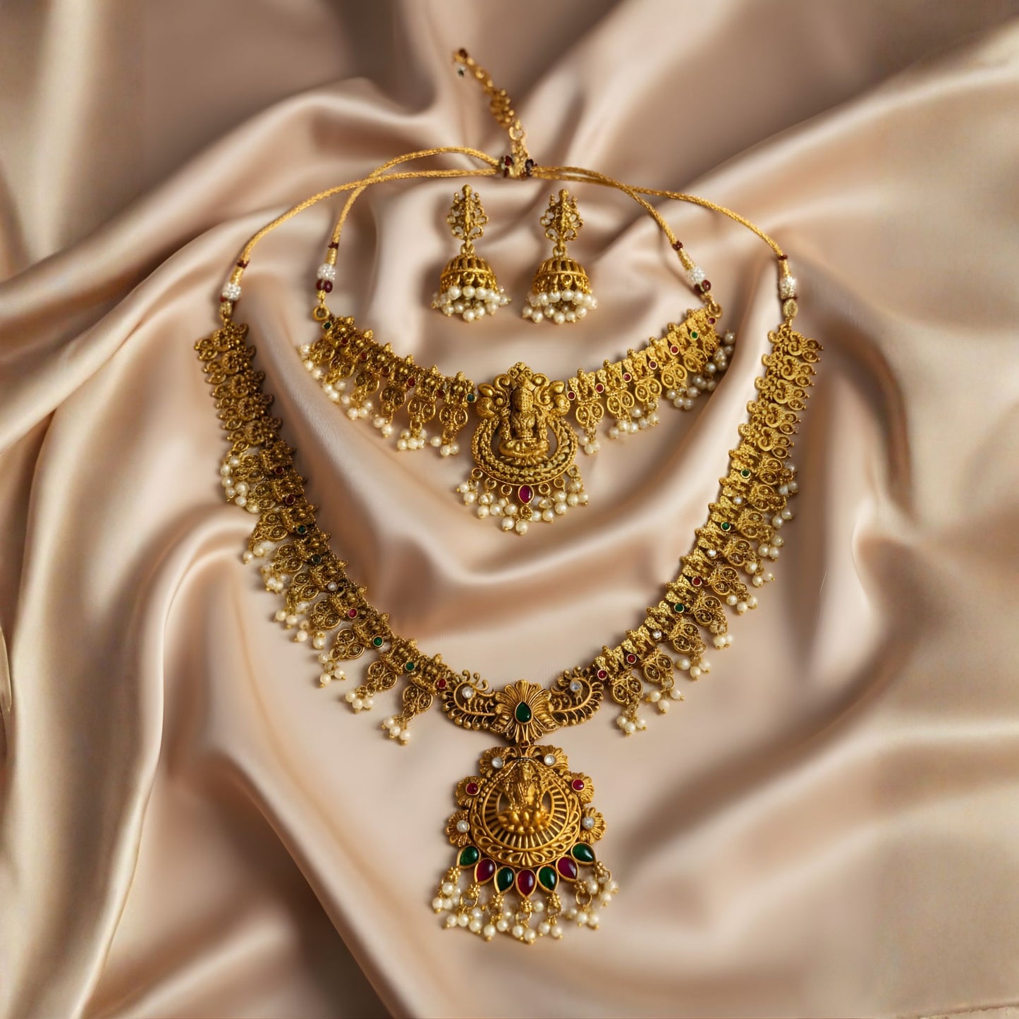 Antique gold Lakshmi temple jewellery set with pearl drops and matching jhumkas