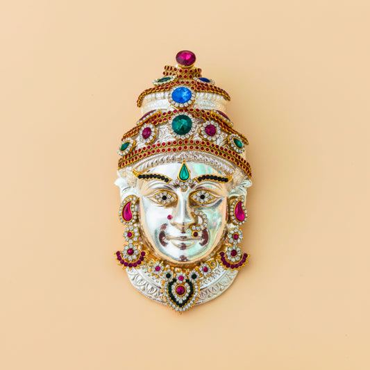 Silver-coated Durga Matha idol decorated with colorful stones, featuring intricate detailing and traditional craftsmanship, perfect for home temple or festive décor.

