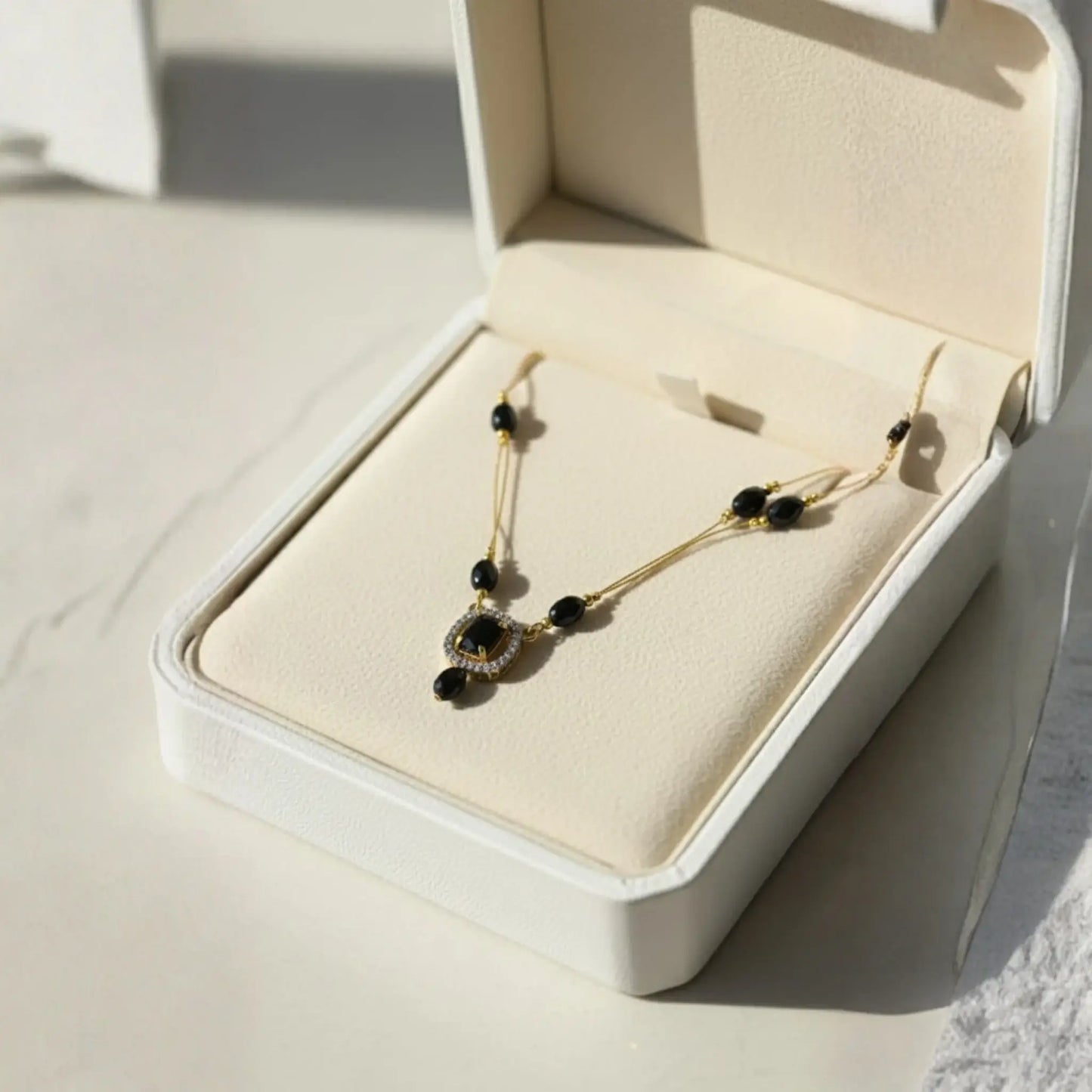 Violet Stone Necklace With Gold-Plated Dual Pendant Design