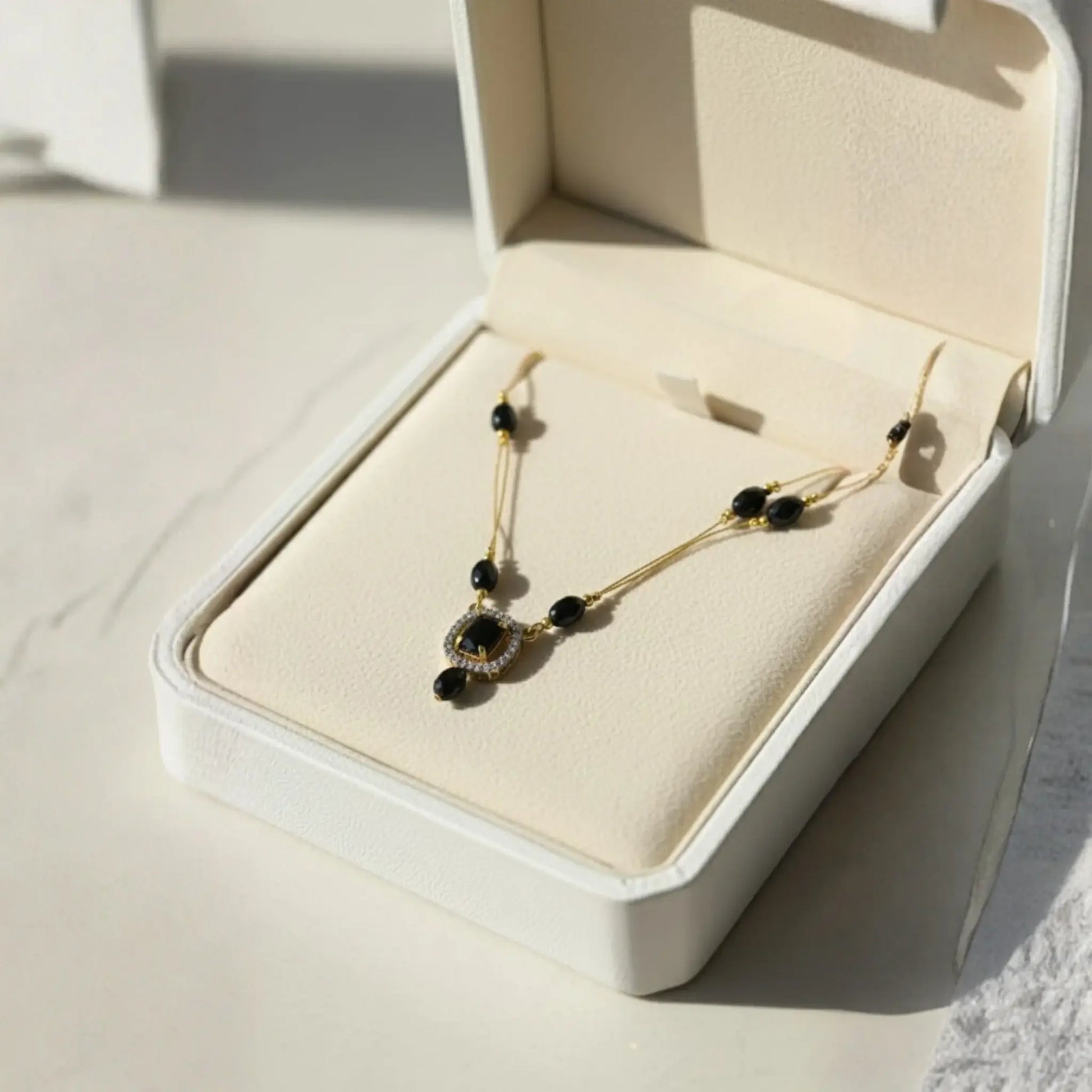 Violet Stone Necklace With Gold-Plated Dual Pendant Design