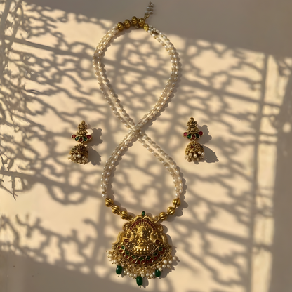 Antique gold Lakshmi temple necklace with pearl strands and matching jhumkas